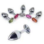 analni čep kovinski srebrne barve